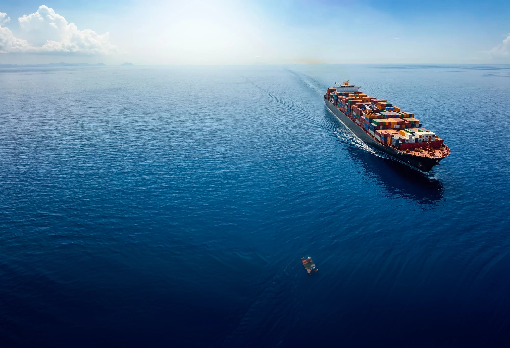 Cargo ship underway across open ocean