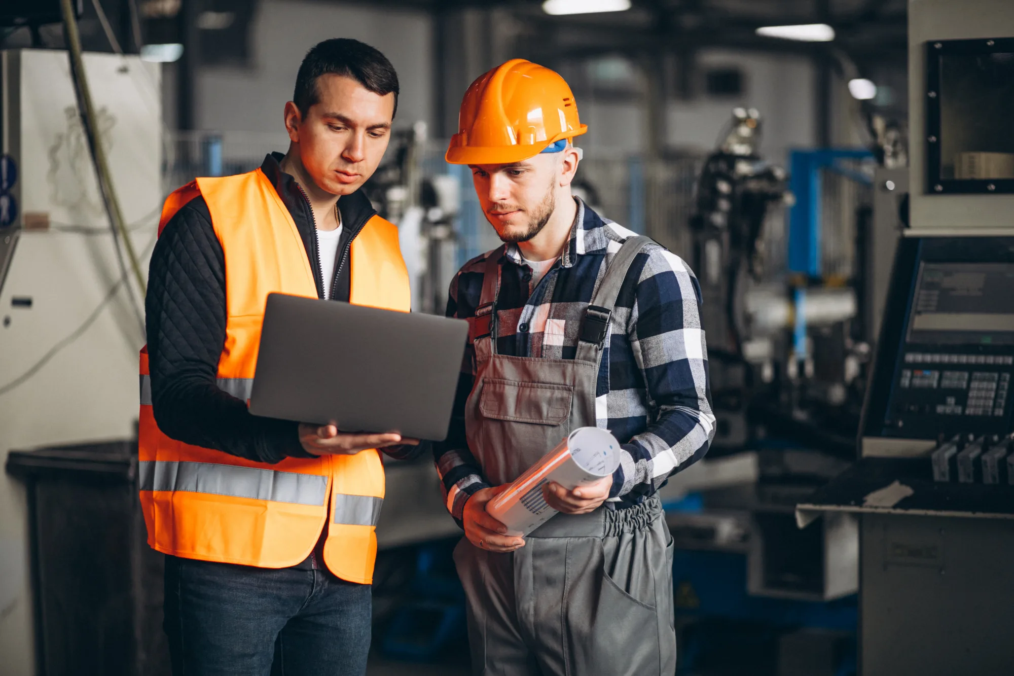 Manufacturing floor team reviewing production data