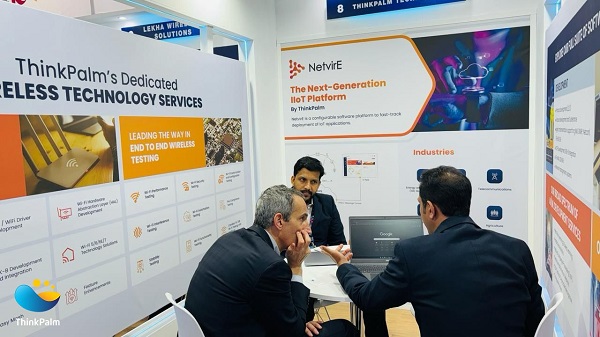 ThinkPalm delegates explaining NetvirE to an interested attendee at MWC Barcelona 2024